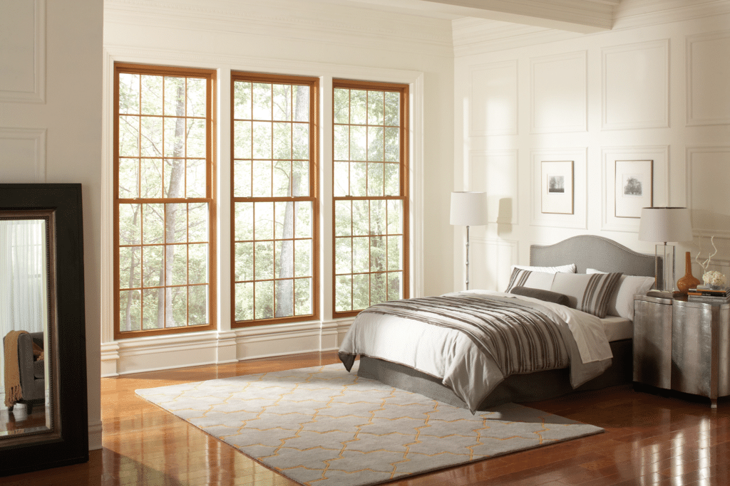 Signature Elite double hung windows with wood grain interior and internal grids.